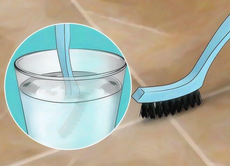  Sử dụng bàn chải lông cứng để chà khe sàn cùng với dung dịch tẩy rửa 